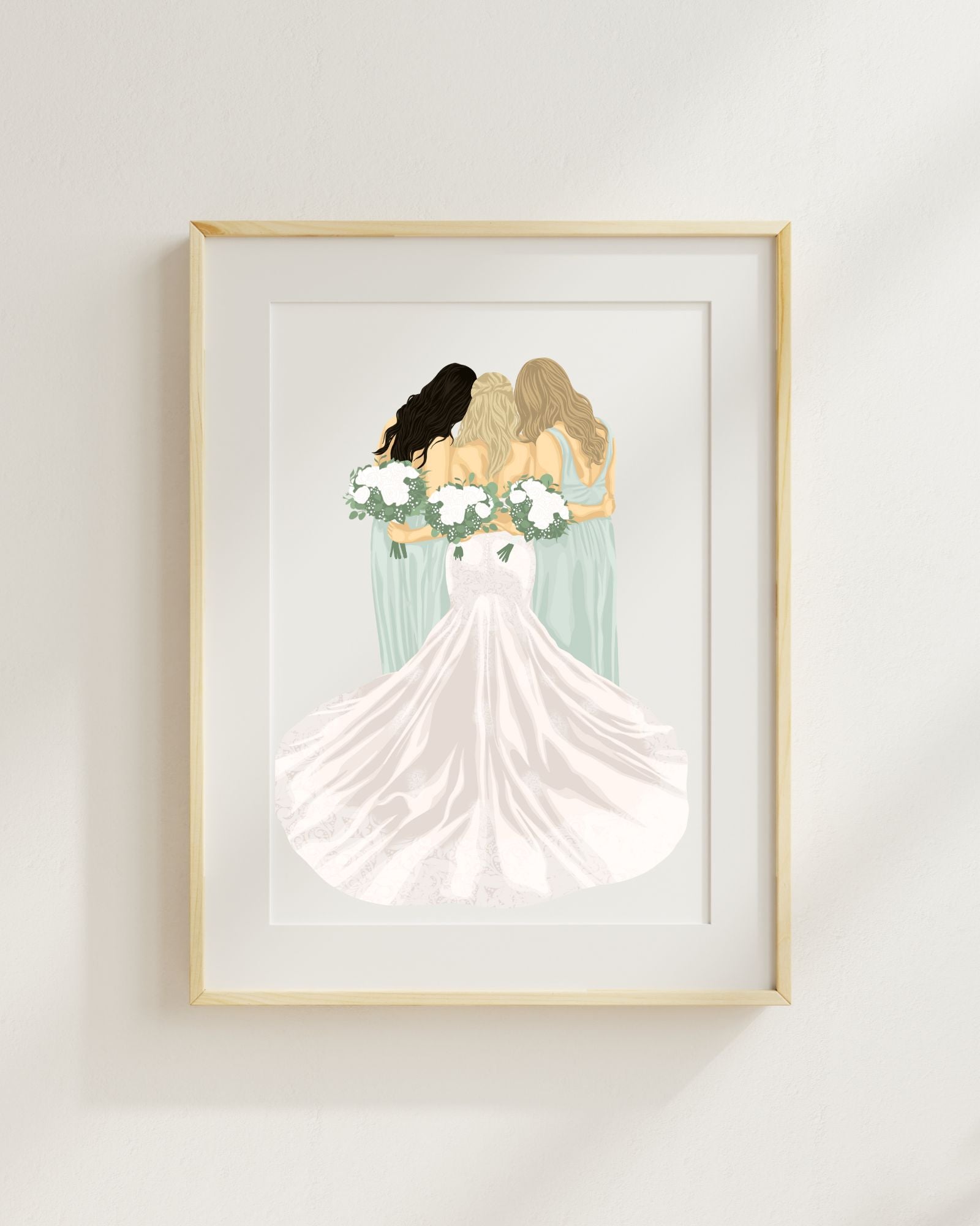 Framed artwork of three women in wedding dresses holding flowers on a white wall.